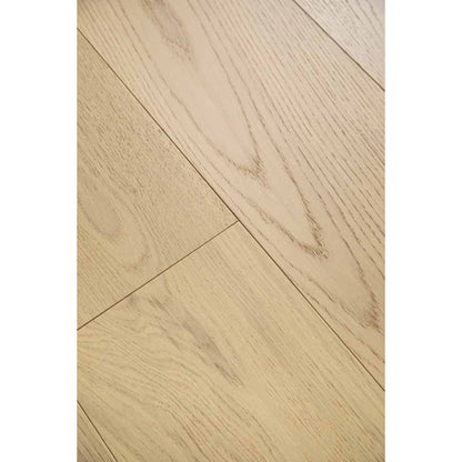 Close-up texture of brushed finish and natural knots on Innato 902 warm chestnut oak plank.