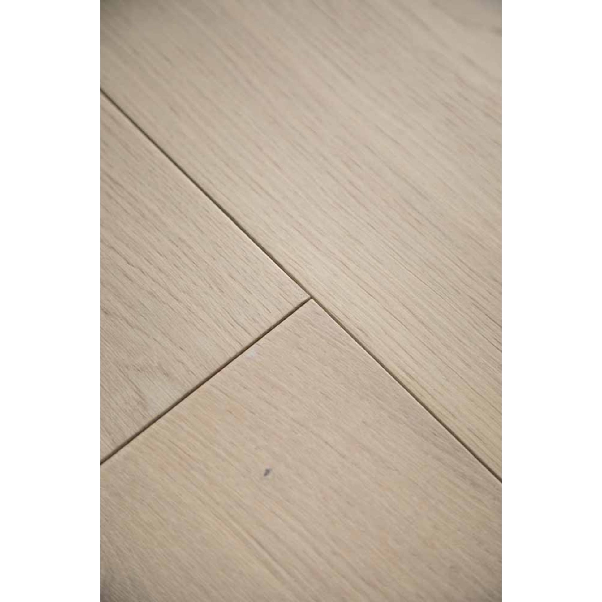 Close-up texture of brushed finish and natural knots on Stella 803 toasted almond oak plank.