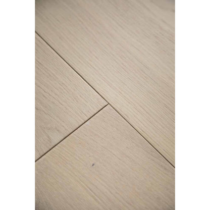 Close-up texture of brushed finish and natural knots on Stella 803 toasted almond oak plank.