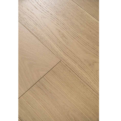 Close-up texture of brushed finish and natural knots on Stella 816 washed distressed greige oak plank.