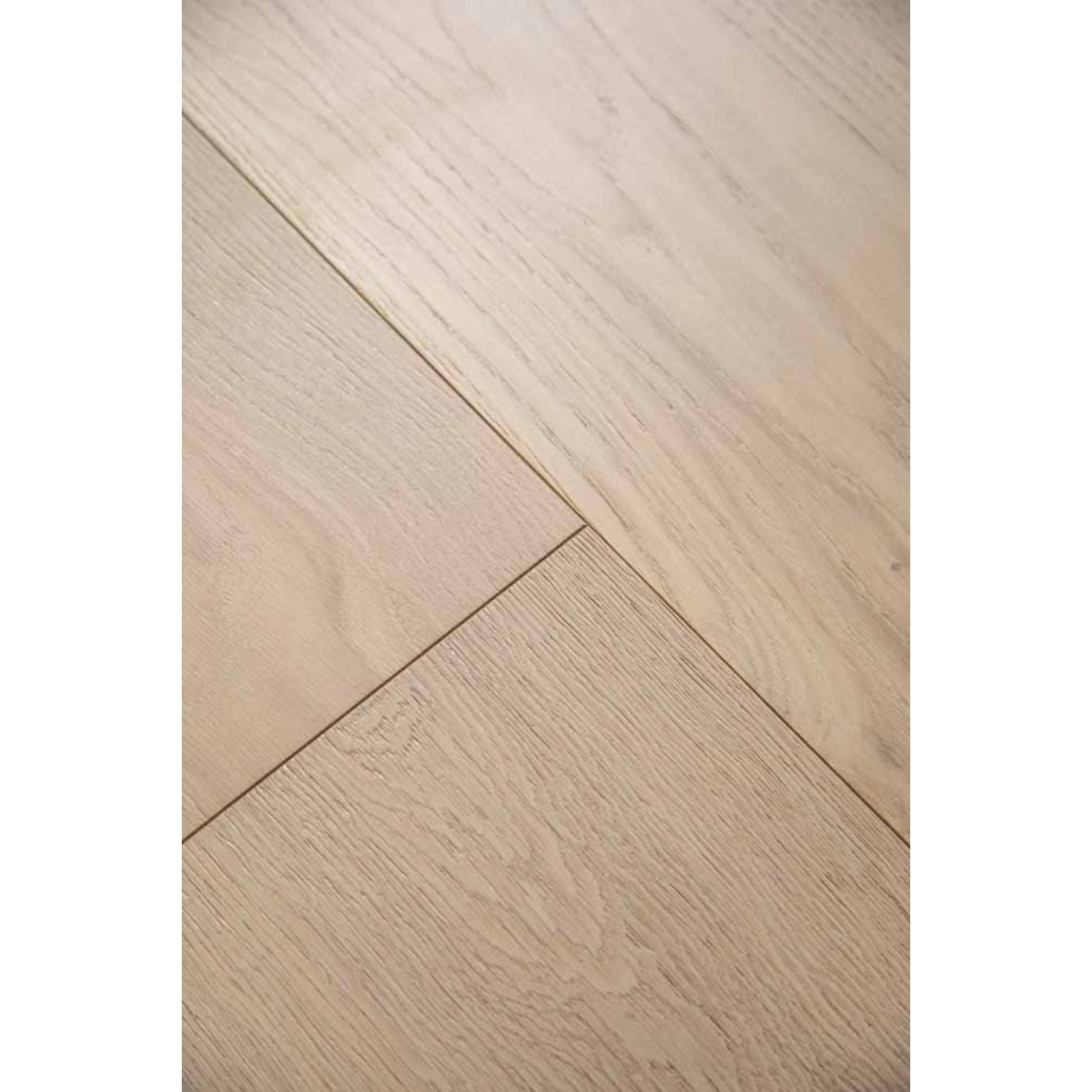 Close-up texture of brushed finish and natural knots on Stella 817 bleached white oak plank.