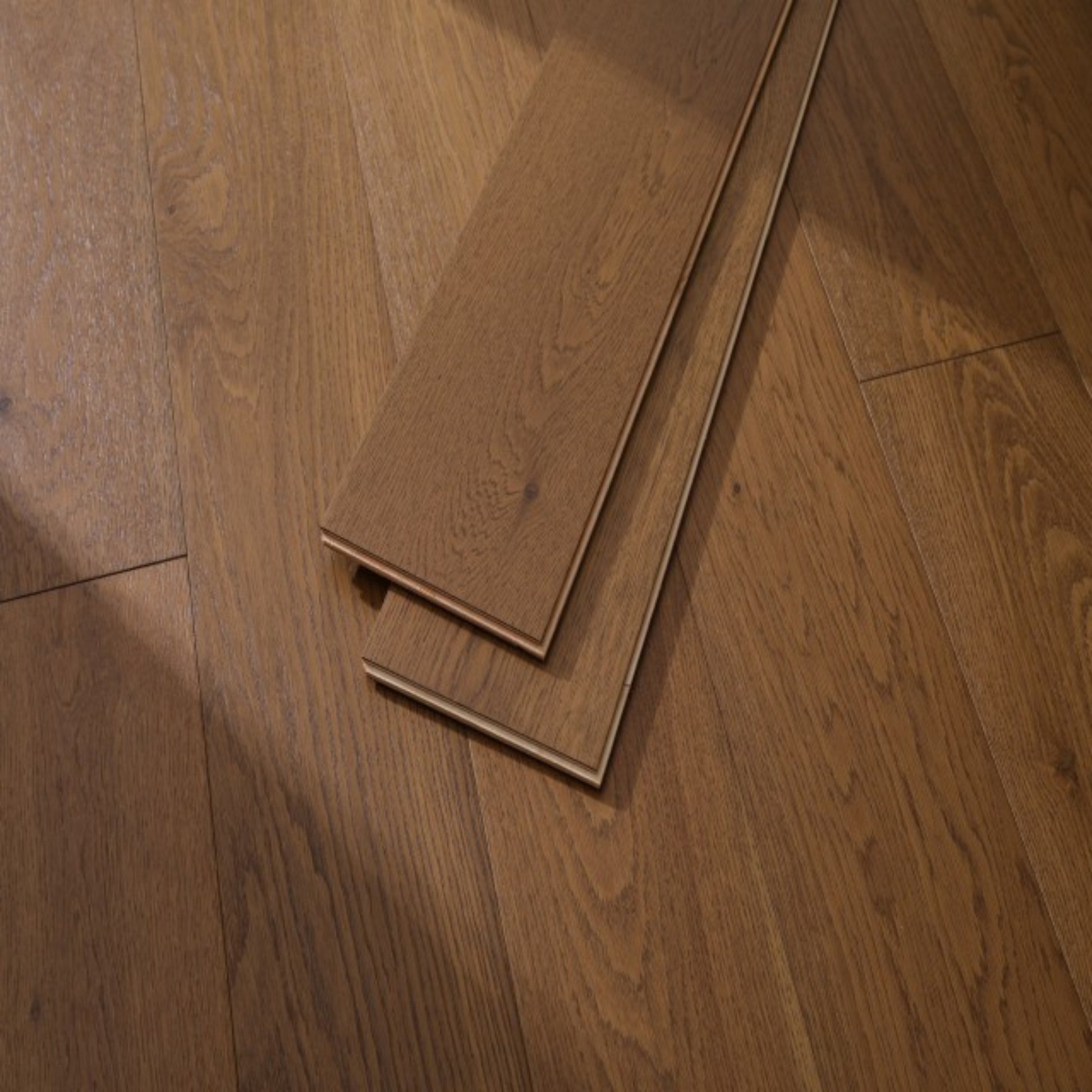 Close-up texture of wire-brushed finish on Vandyck Progettista 111 honey European oak plank.