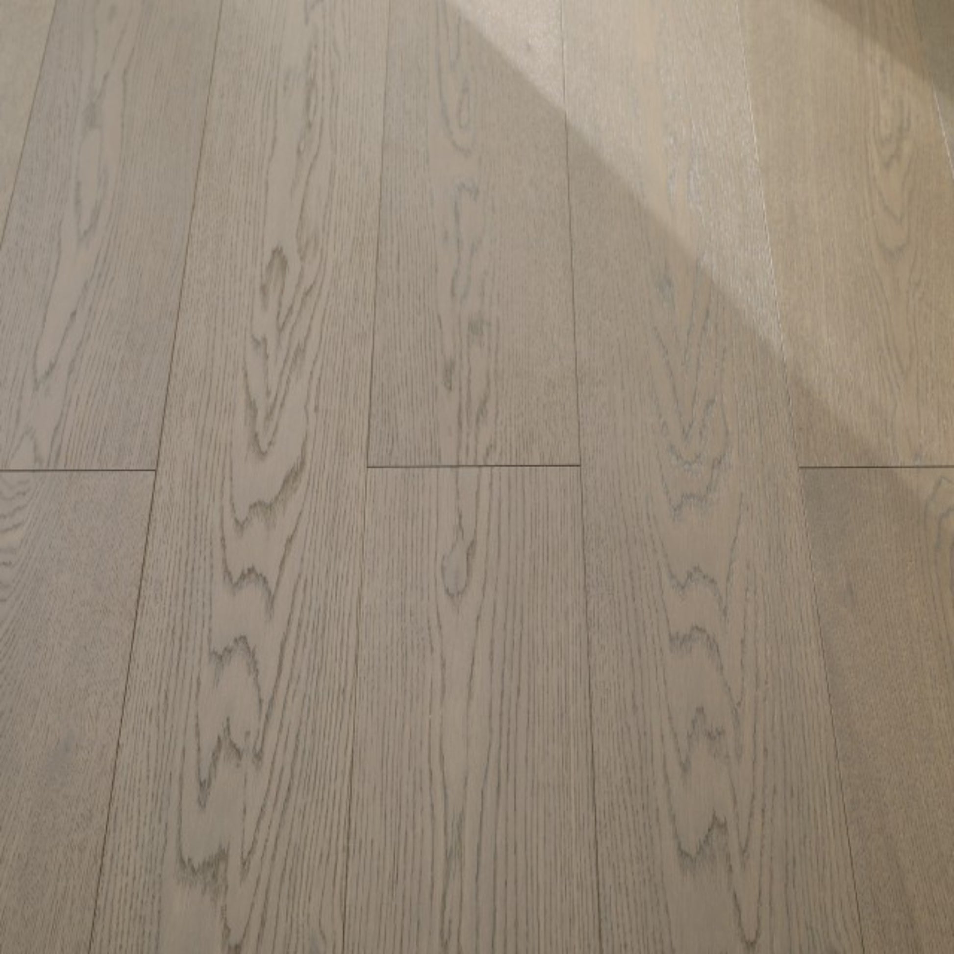 Vita 608 wire-brushed ash blonde European oak engineered wood flooring planks showing select grade.