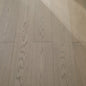 Vita 608 wire-brushed ash blonde European oak engineered wood flooring planks showing select grade.