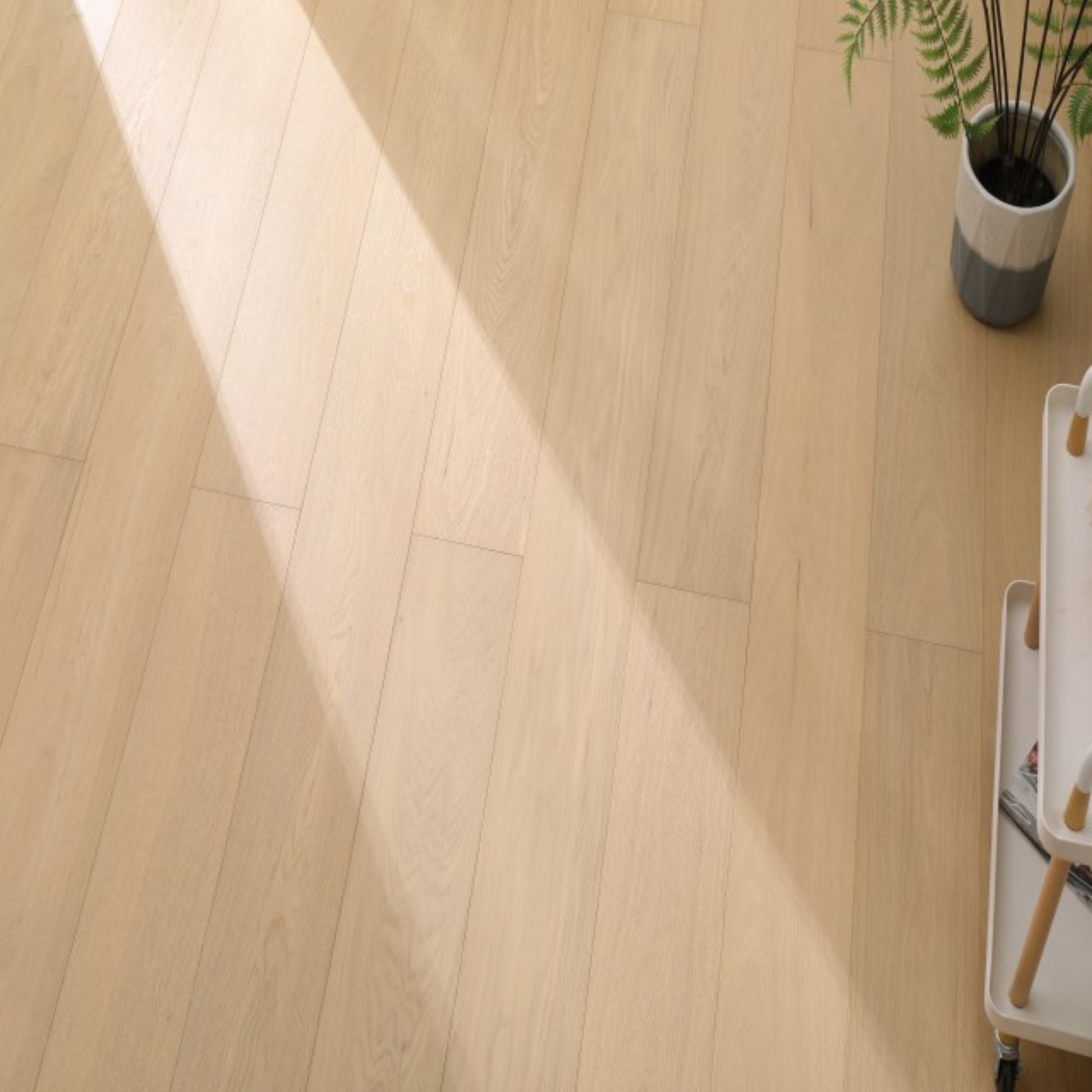 Vita 605 wire-brushed warm honey European oak engineered wood flooring planks showing select grade.