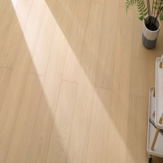 Vita 605 wire-brushed warm honey European oak engineered wood flooring planks showing select grade.